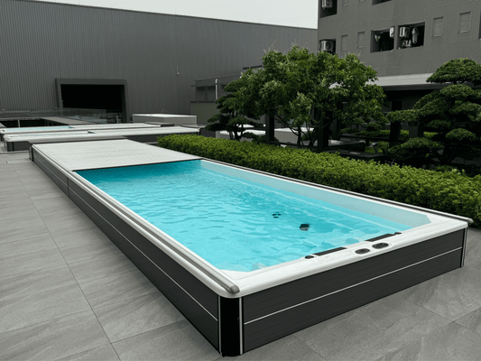 swim spa installed part inground fitted with automated slatted swim spa cover 