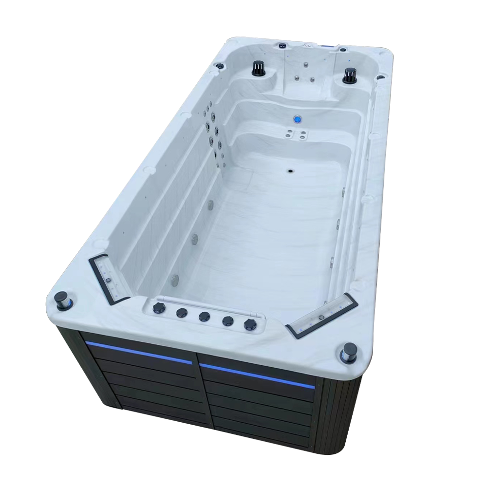 Side view of single temperature swimspa with two waterfall features, pop up speakers and LED cabinet lighting 