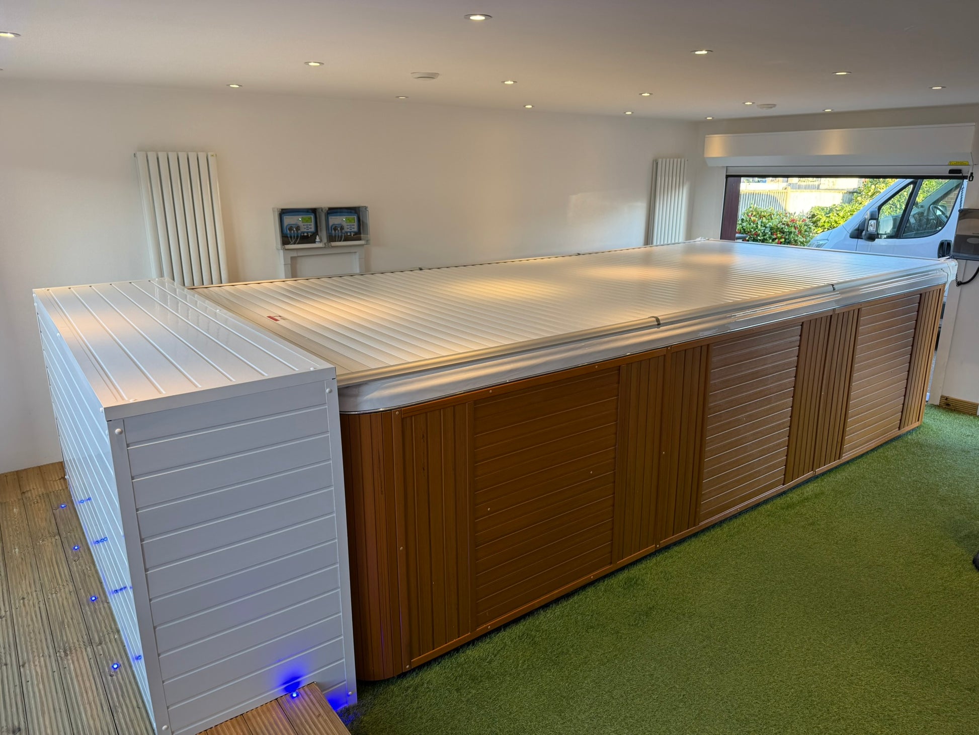Swim spa installed inside with an automated cover fitted