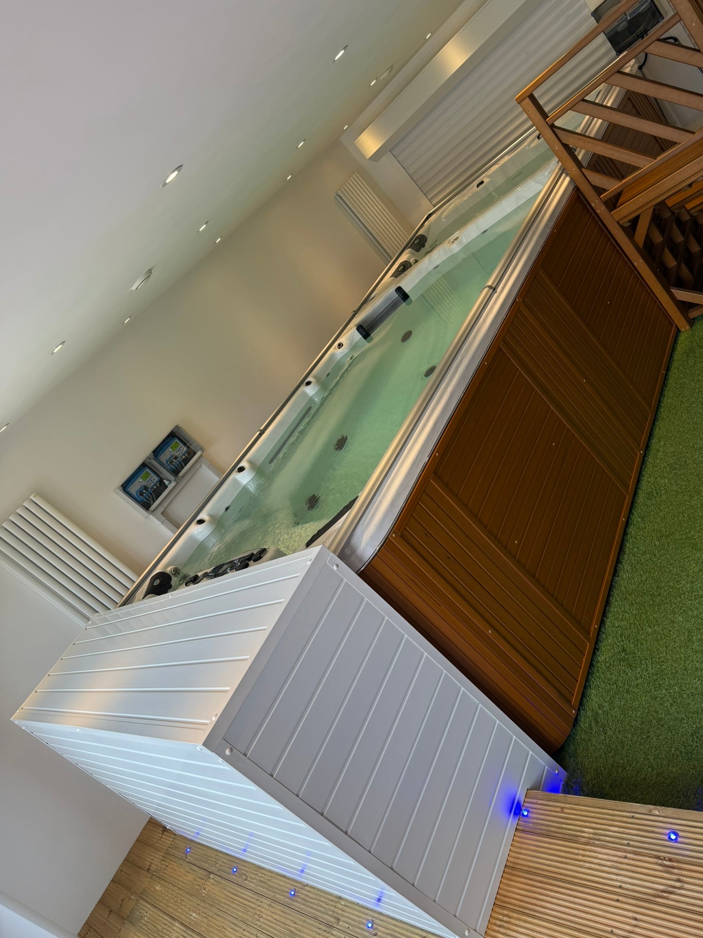 Swim spa installed inside a room with an automated cover fitted