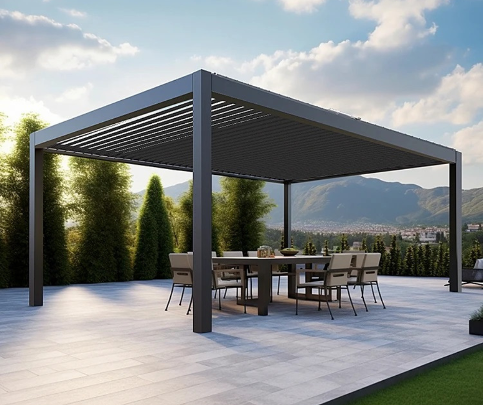 A modern gray EZ Cover Pergola with double-layer louvres over a outdoor dining area, set against a mountainous landscape.