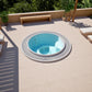 circular round white hot tub sunk in ground garden patio 