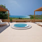 circular round white hot tub sunk in ground patio with landscape view