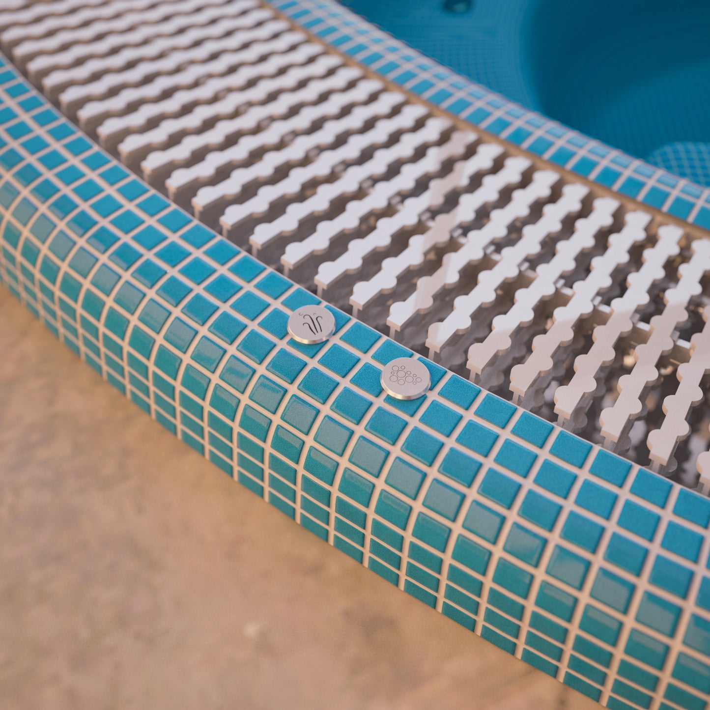 close up image of a mosaic hot tub with overflow grate