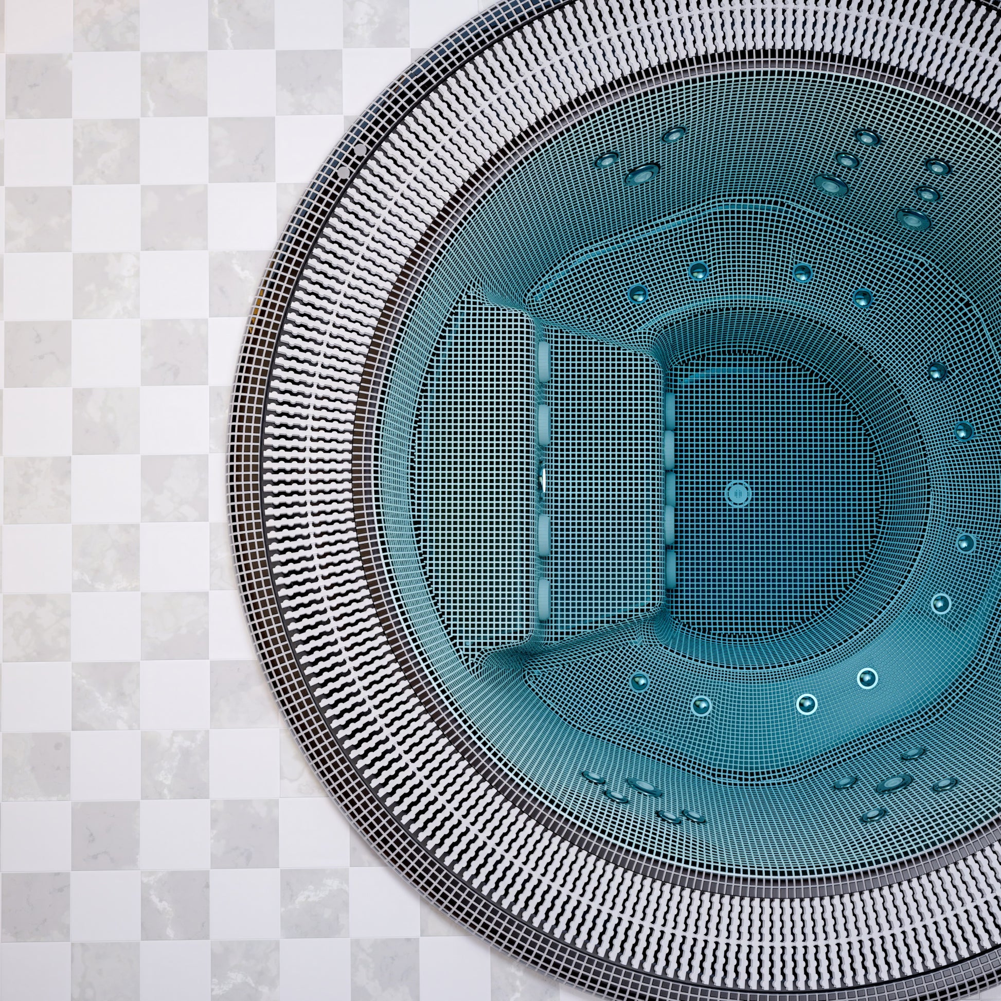 close up of a mosaic hot tub installed in ground