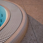 Close up of a mosaic hot tub installed inground