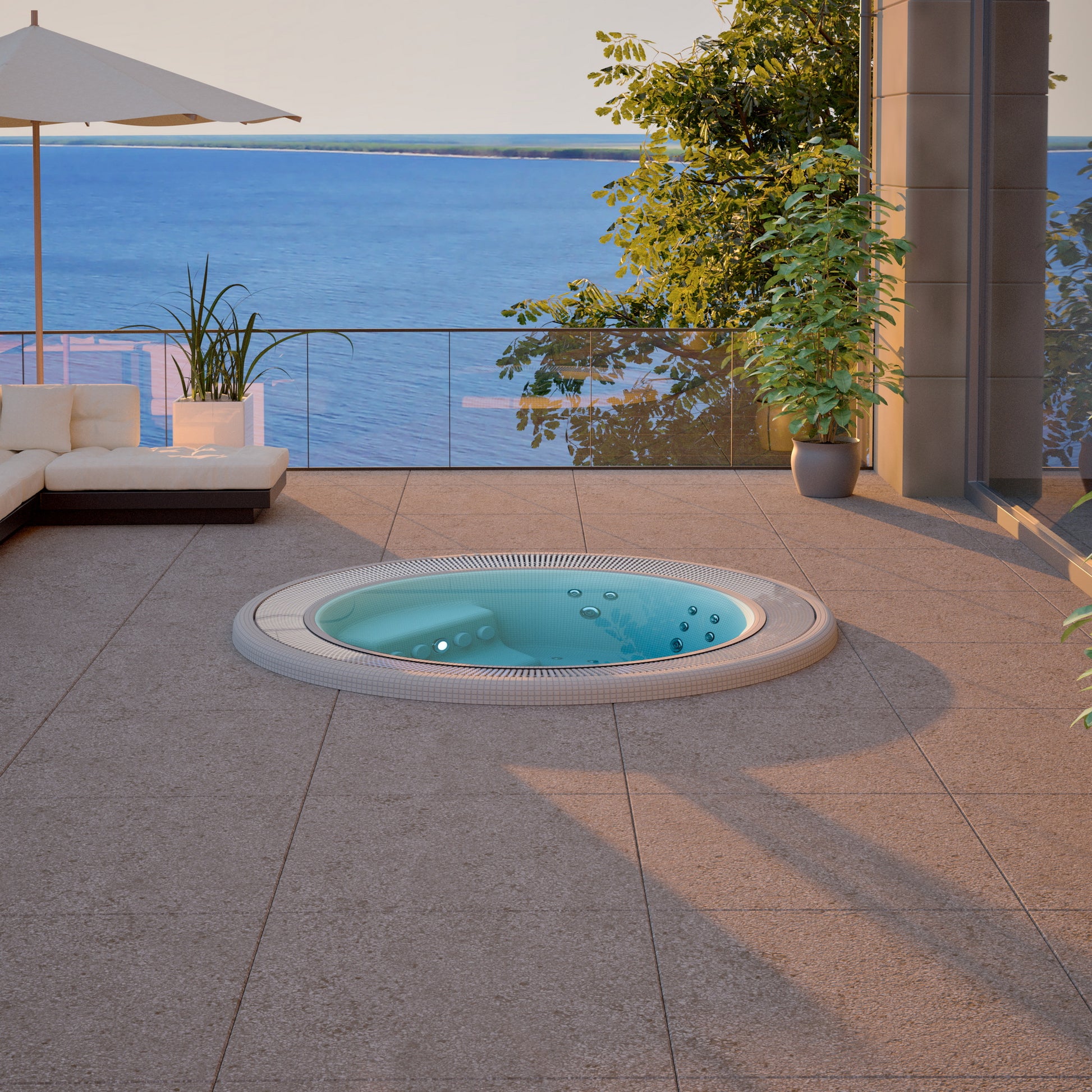 Outdoor mosaic hot tub with a view of the ocean and lounge area