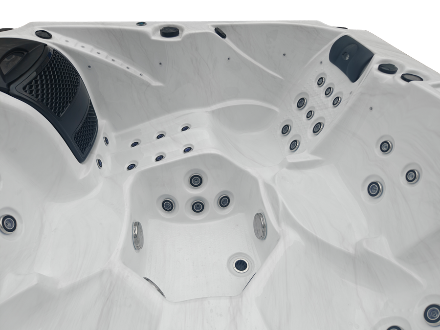 Close-up of a hot tub with multiple jets and a white interior.