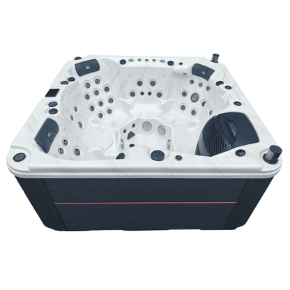 Side view of a hot tub with a sterling marble shell and grey cabinet